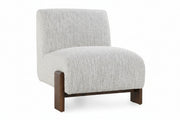 A modern low-profile accent chair with a textured light gray bouclé fabric upholstery and dark brown wooden legs, shown against a plain white background.