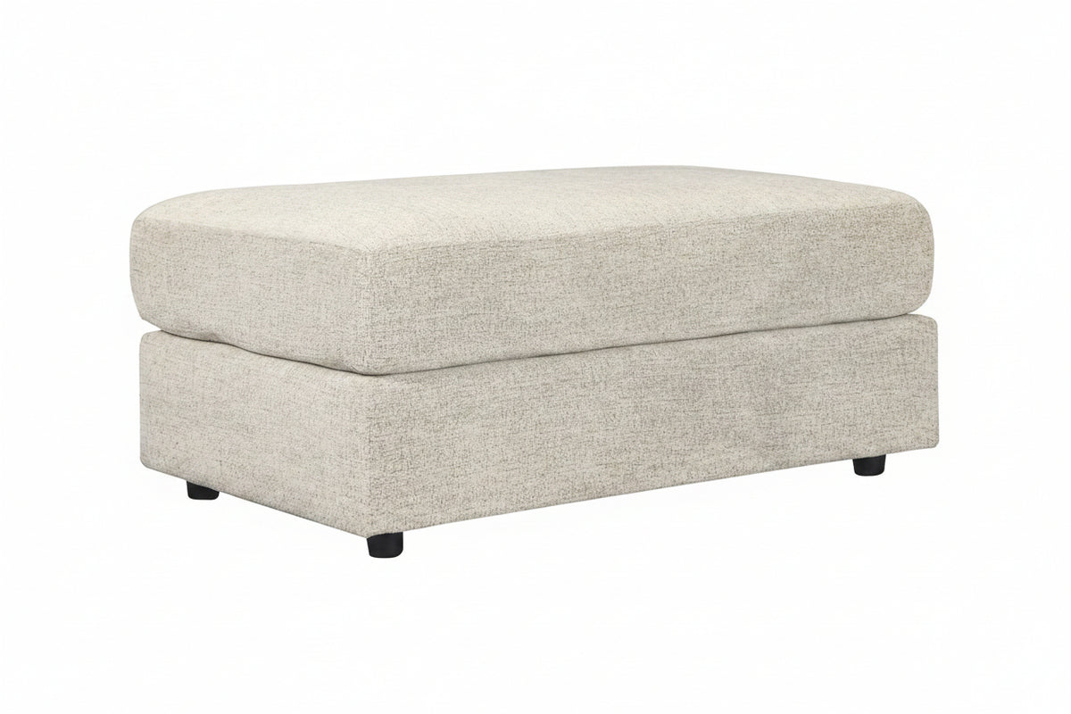Beige ottoman with a textured surface on a white background