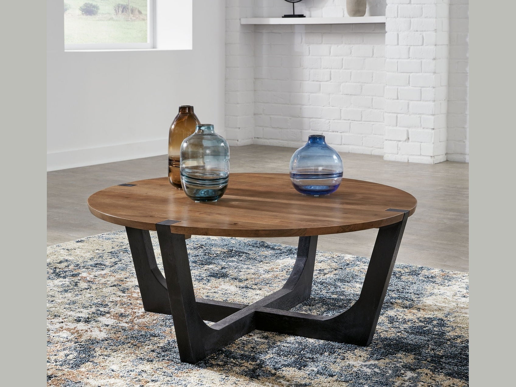 Hanneforth - Round Cocktail Table - Brown