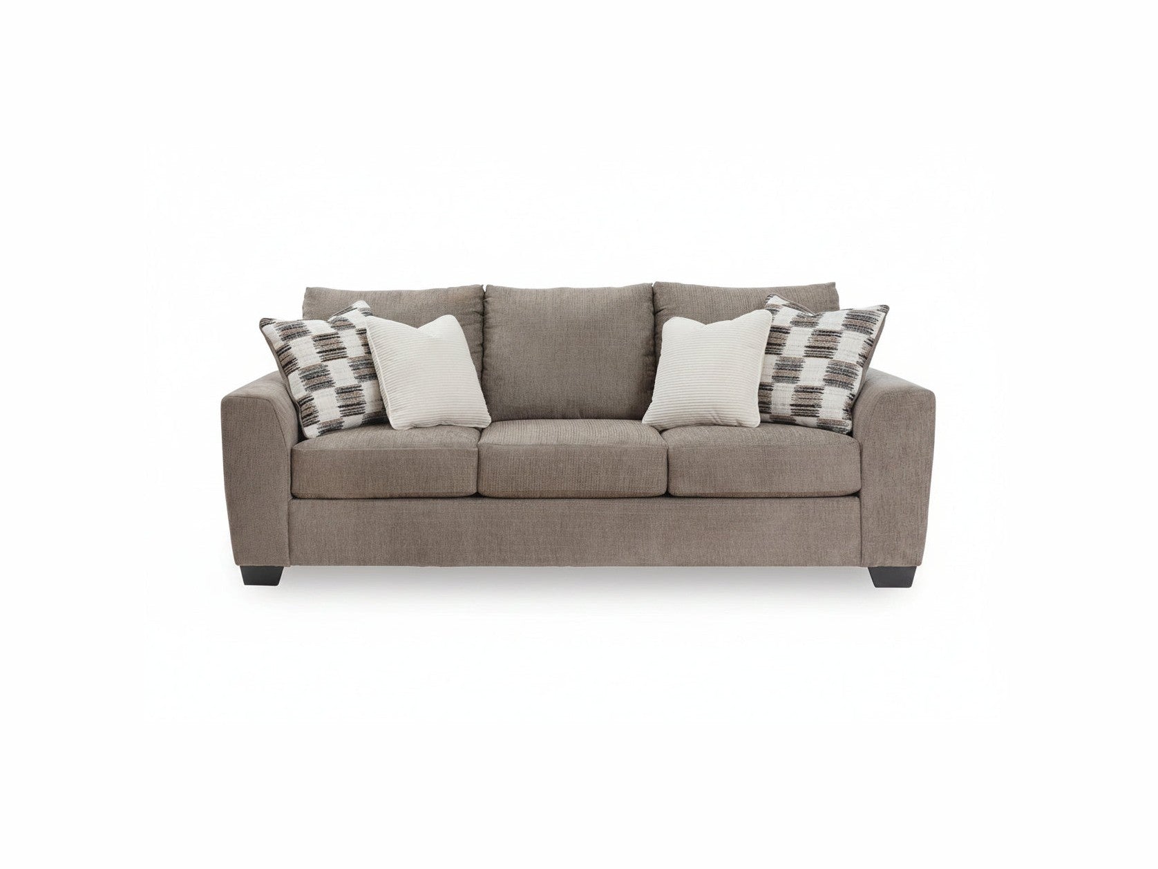Gray sofa with patterned and solid cushions on a white background