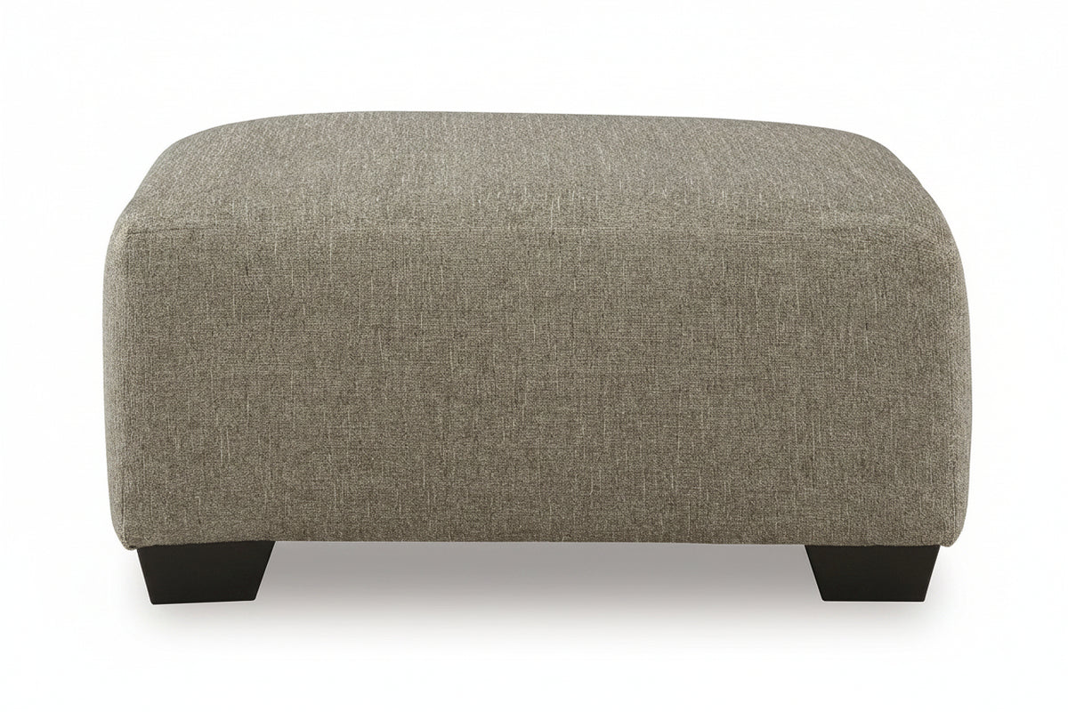 Gray upholstered ottoman with black legs on a white background