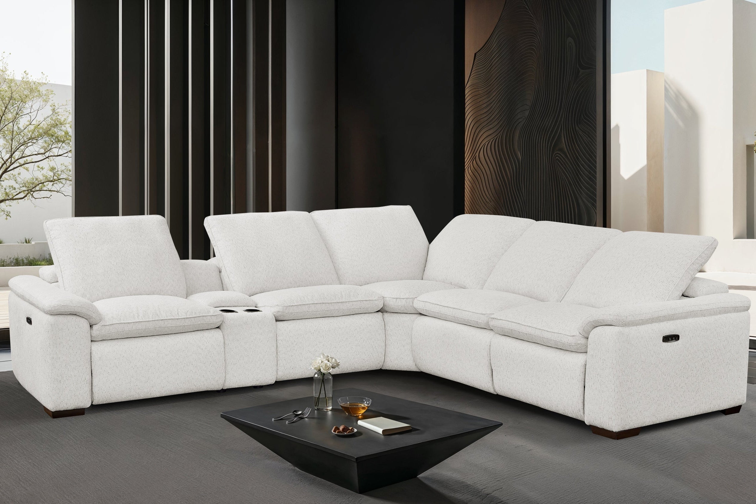 White sectional sofa in a modern living room with a coffee table.