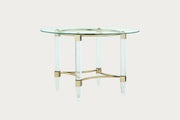 4038 glass-top dining table with gold accents on a white background