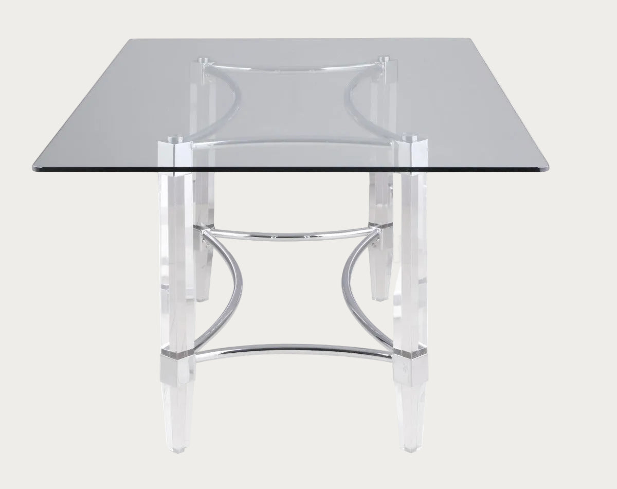 Glass table with chrome metal frame on a white background