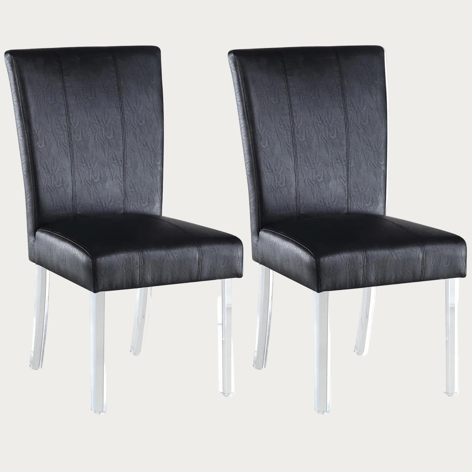 Two 4038 side chairs upholstered in black faux leather with acrylic legs on a white background