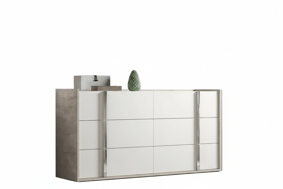 A modern white dresser with a tall matching mirror, styled in a minimalist room with a textured beige wall and light wood flooring.