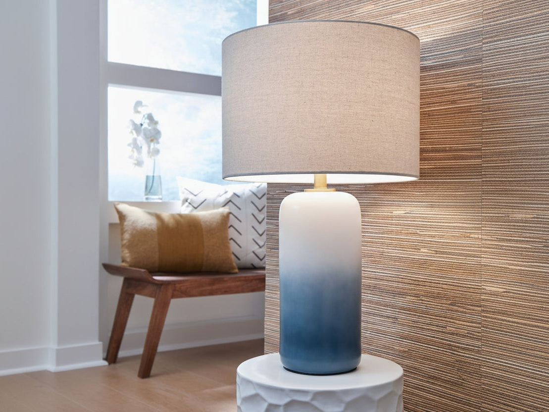 Lemrich decorative lamp with a gradient design on a white surface, with a window and bench in the background.