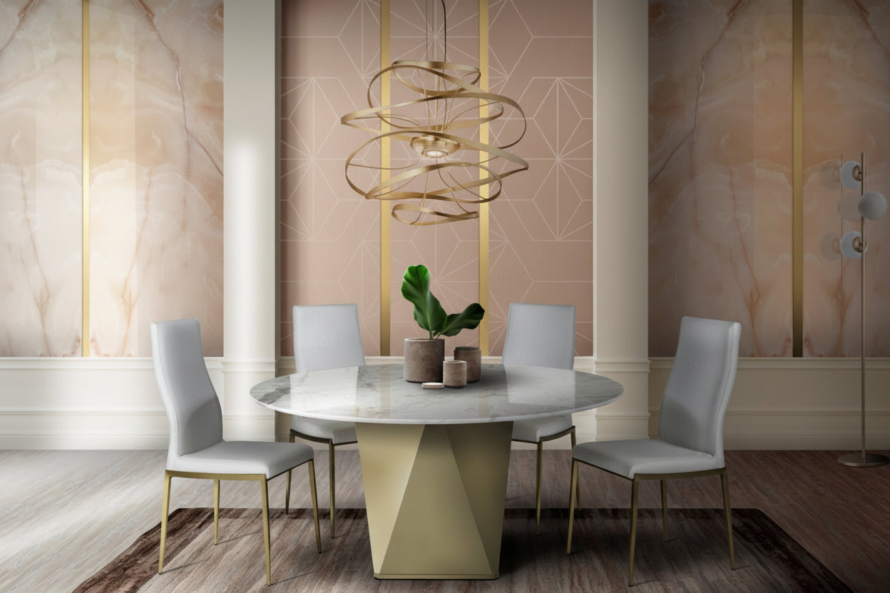 The Diamond modern dining table with a round marble top and white chairs, featuring a stylish chandelier.