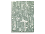 Textured green and white patterned rug on a plain background