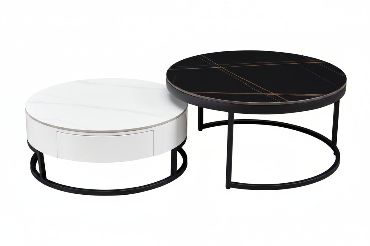 Two round coffee tables, one white and one black with a metallic finish, on a white background.