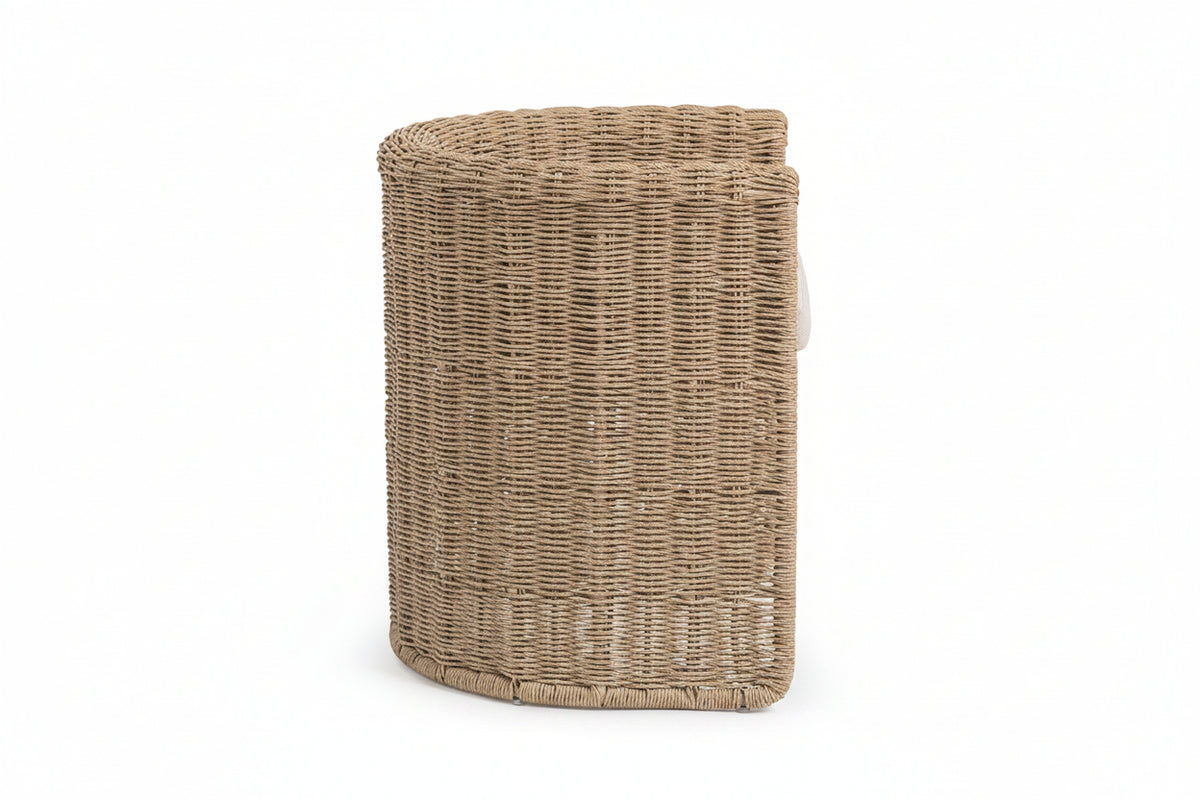 Woven rattan laundry basket on a white background