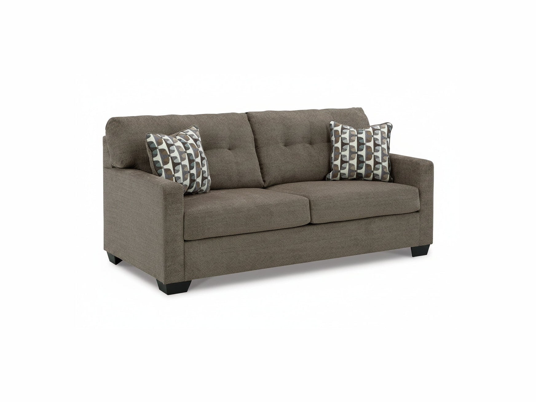 Brown sofa with patterned cushions on a white background