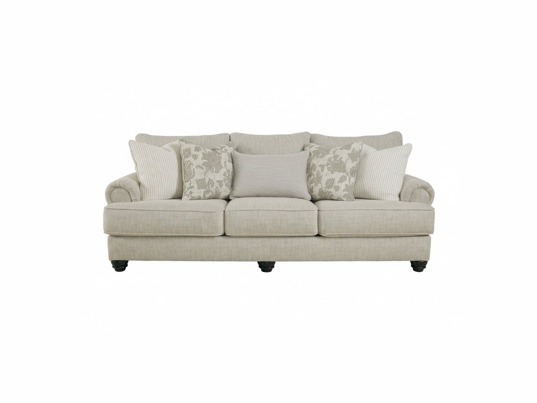 Beige sofa with patterned cushions on a white background