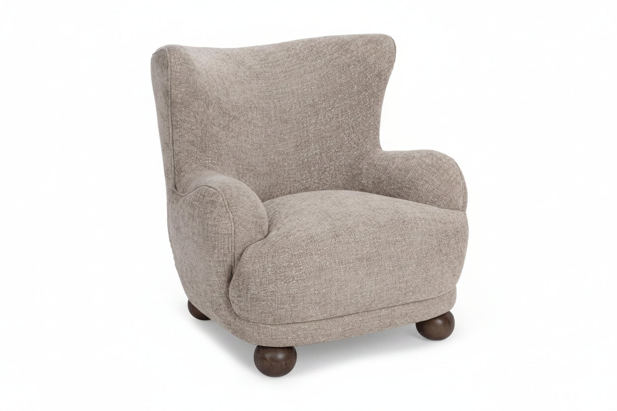 Beige armchair with wooden legs on a white background