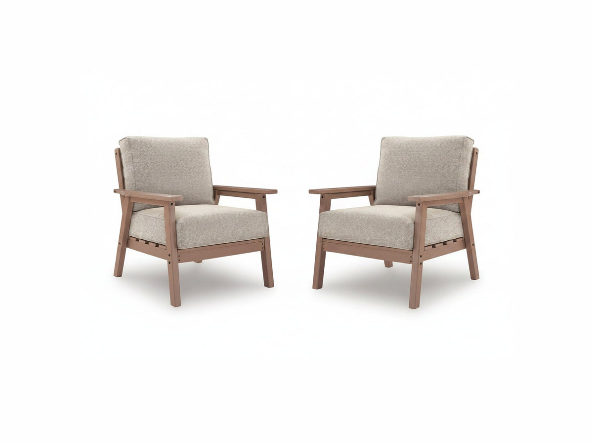 Two wooden chairs with beige cushions on a white background