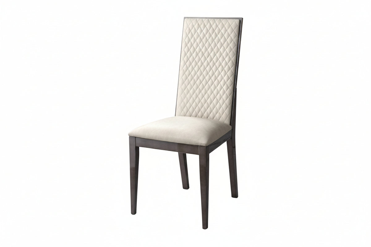 A modern dining chair with a cream tufted upholstered backrest and seat cushion, supported by a dark brown wooden frame with tapered legs, shown against a plain white background.