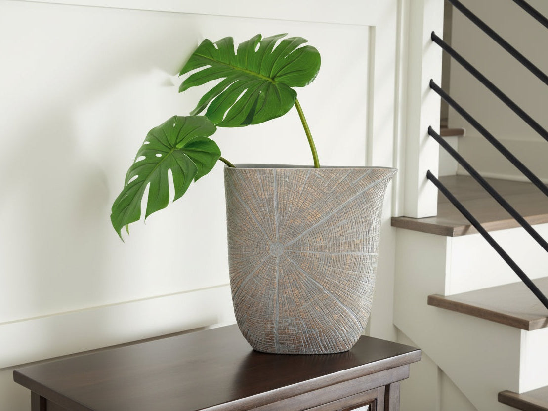 Decorative pot with textured design on a wooden surface