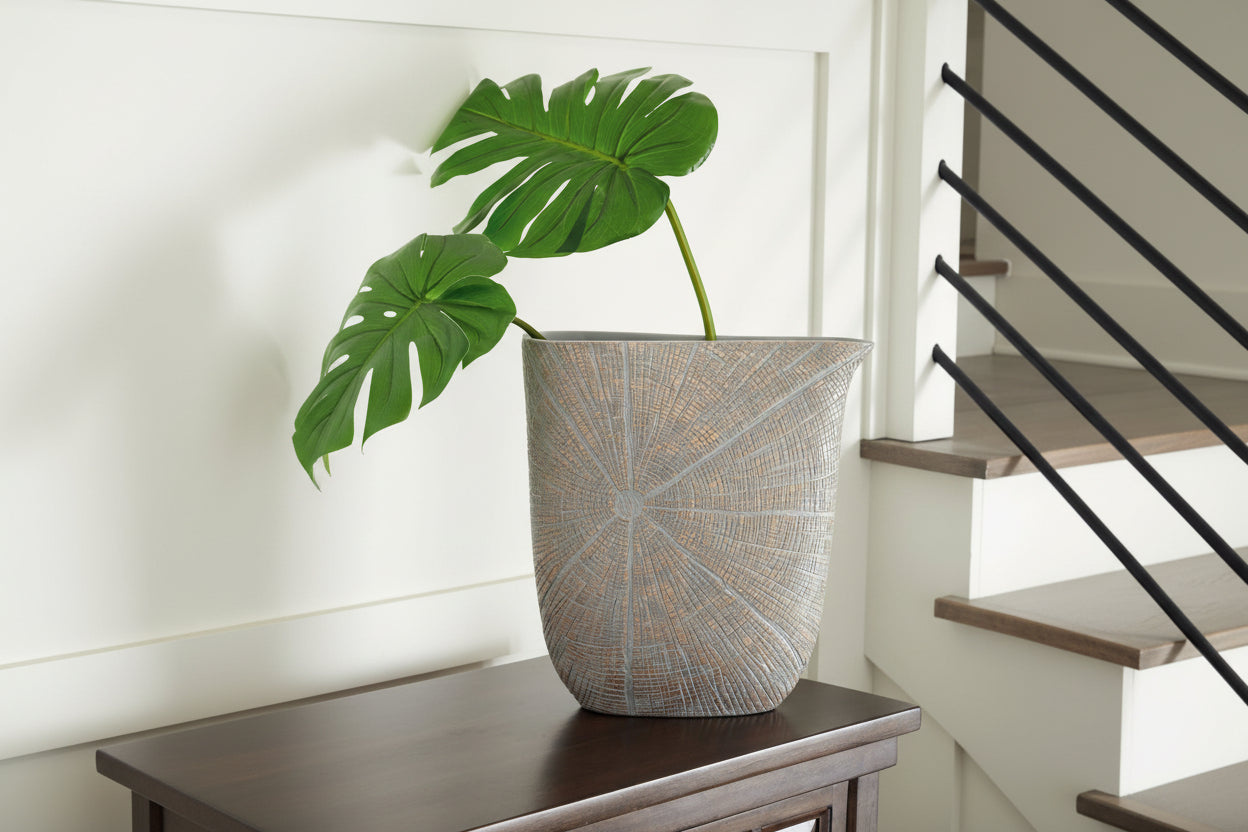 Decorative pot with textured design on a wooden surface
