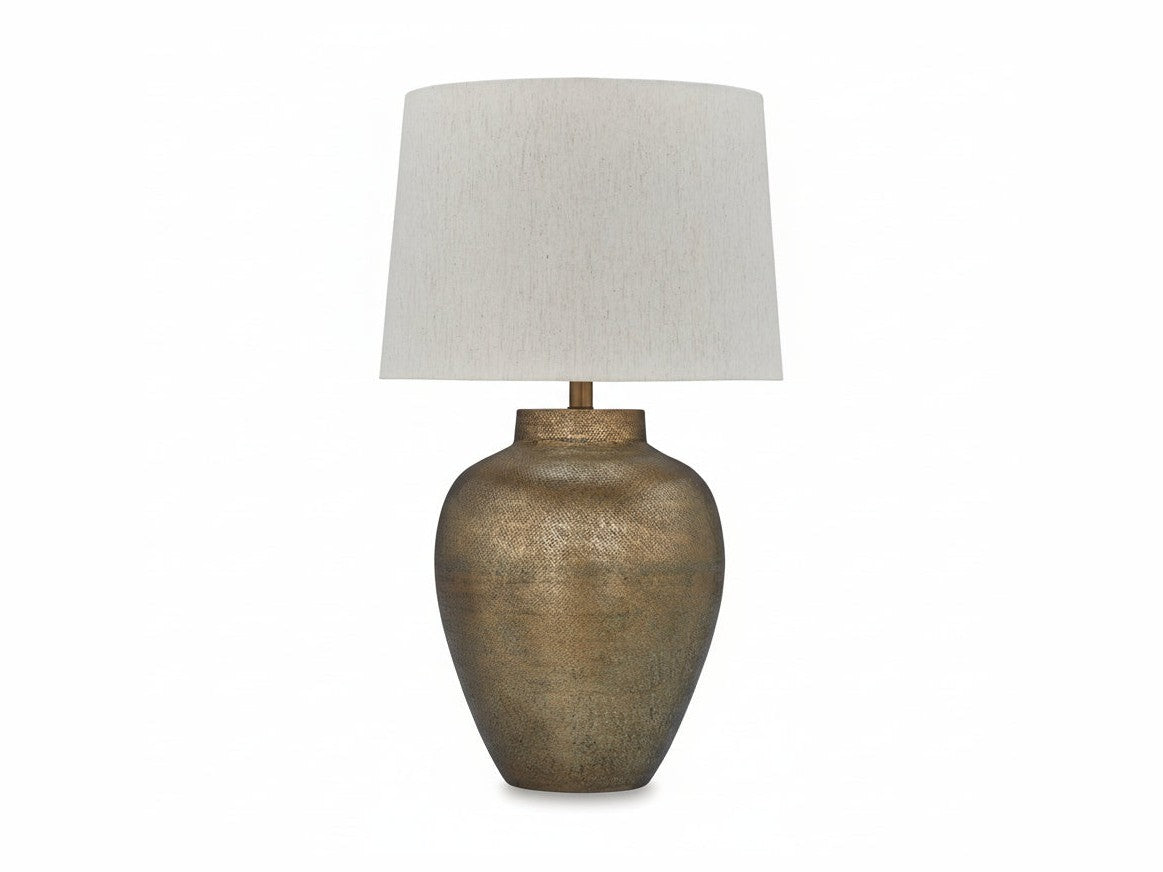 MAdney table lamp with textured bronze base and white lampshade on a white background