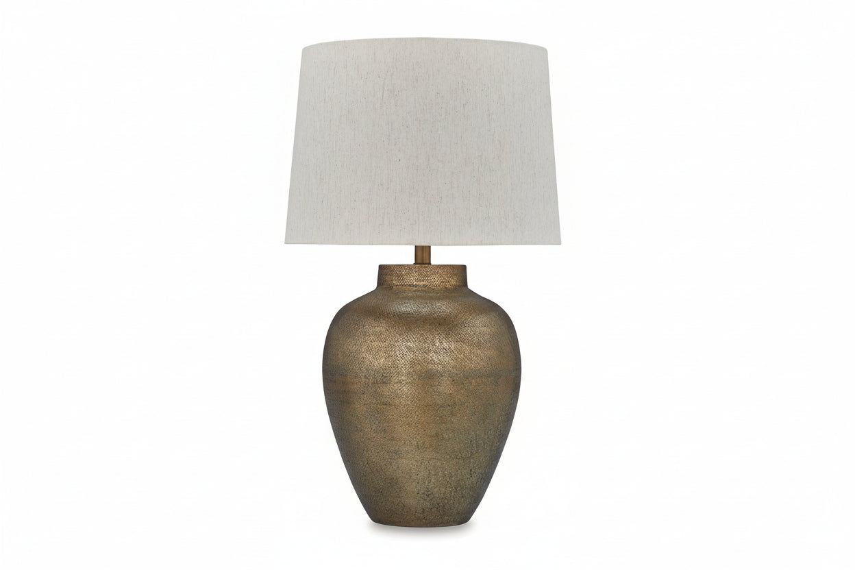 MAdney table lamp with textured bronze base and white lampshade on a white background