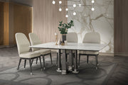 Dining room with a marble table and chairs in a stylish interior setting.