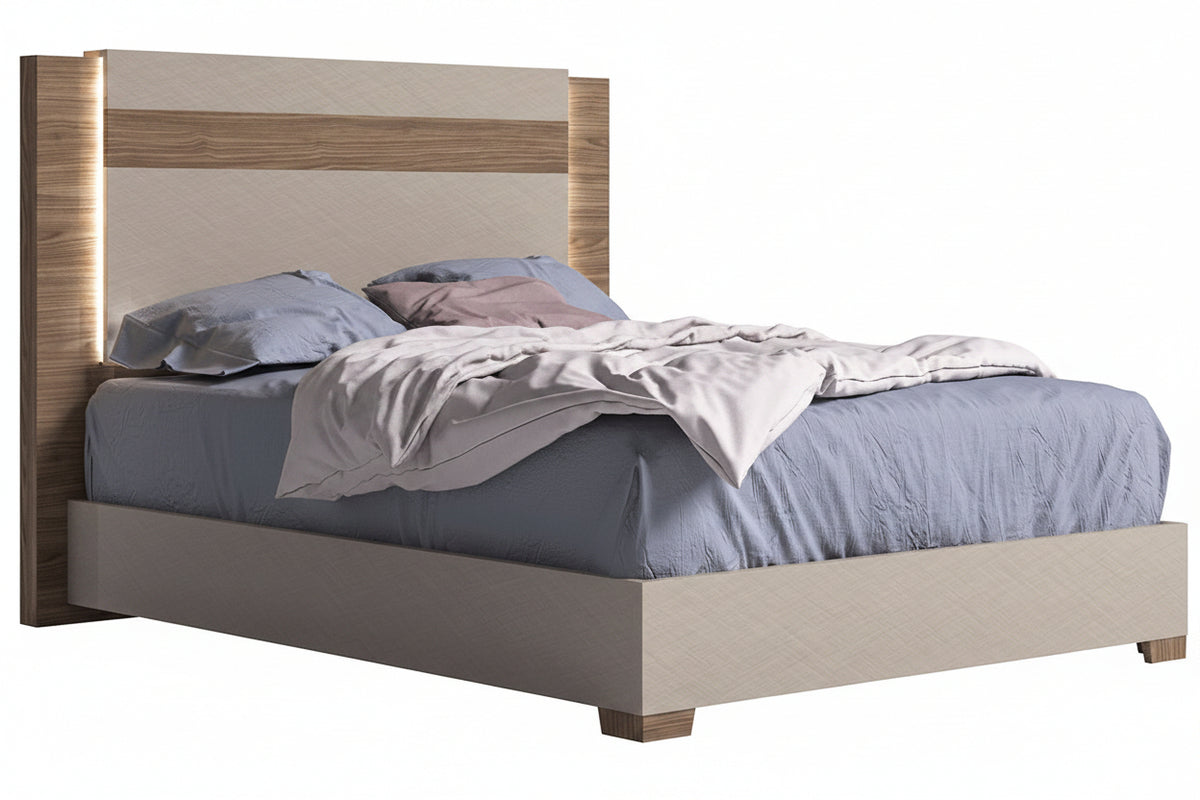 Bed with wooden headboard and gray bedding on a white background