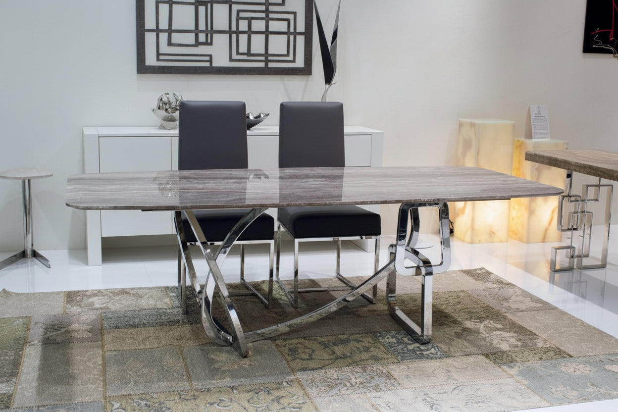 The Tangle dining table with chairs in a modern interior setting.