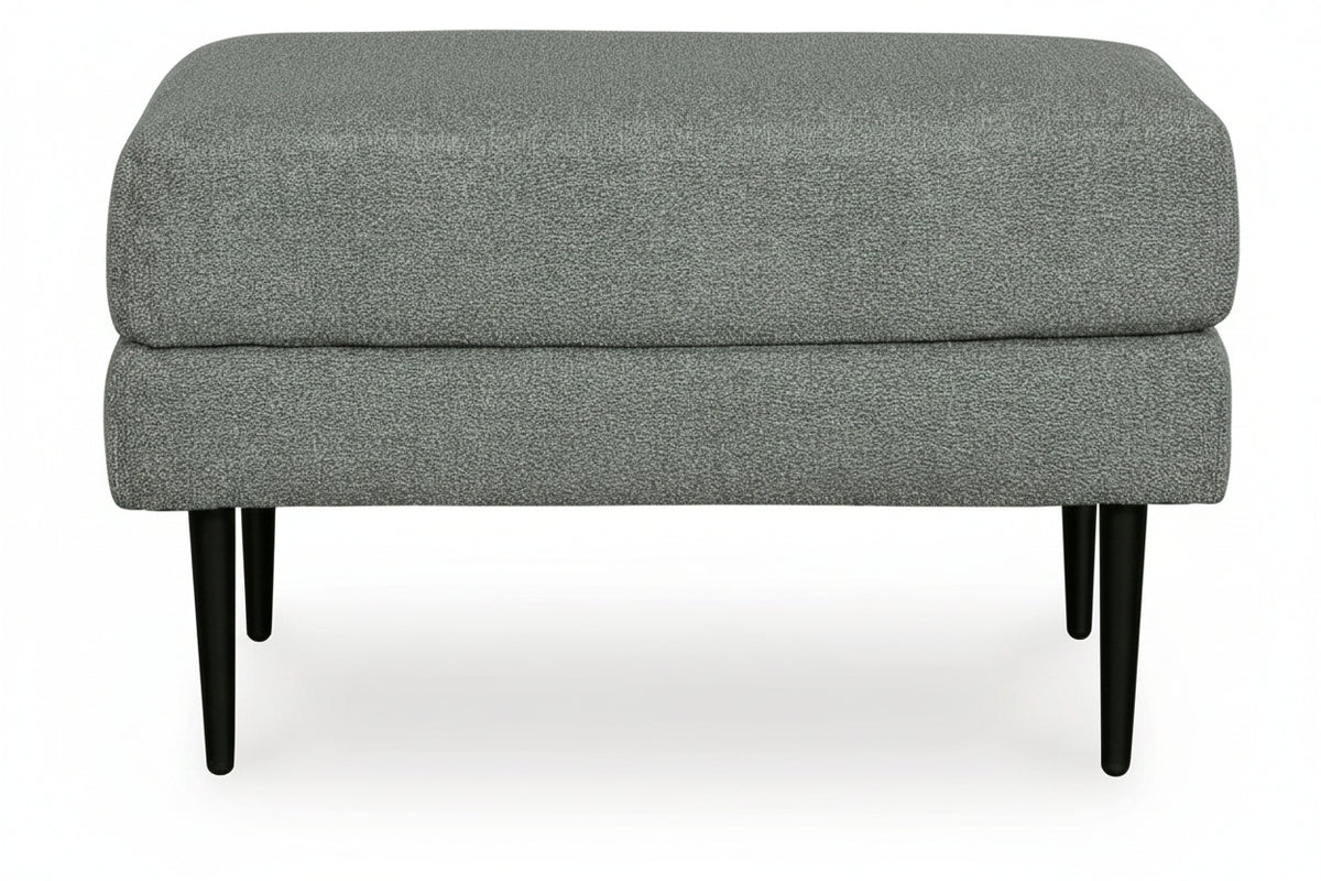 Gray upholstered ottoman with black legs on a white background