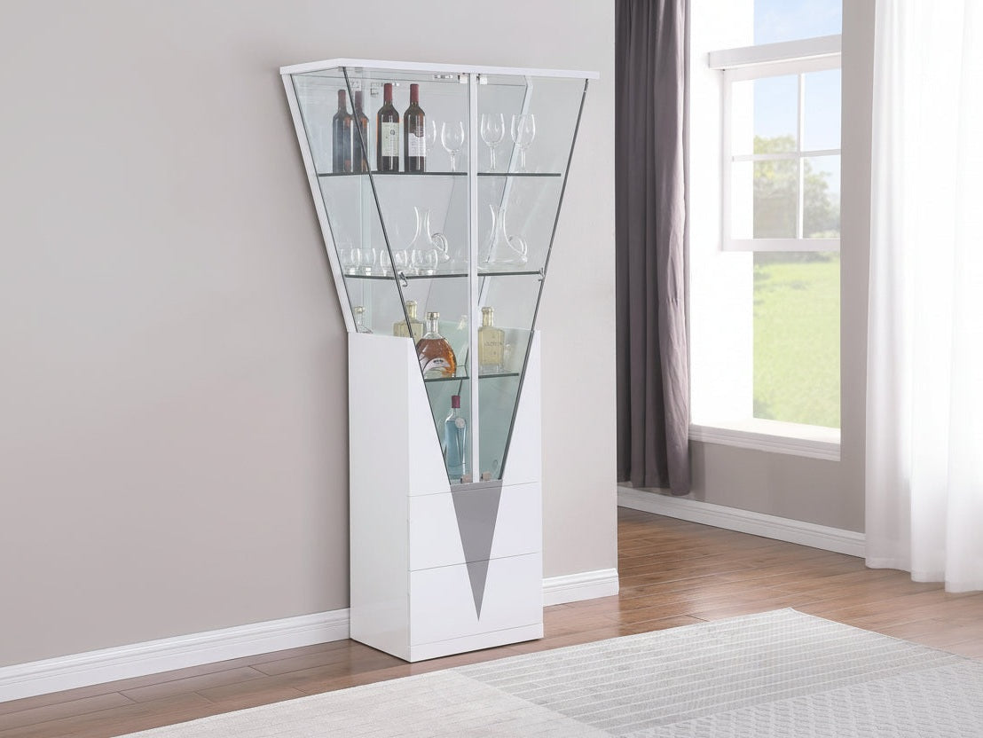 Tall white 6625 Curio with glass shelves in a room with a window and curtains.