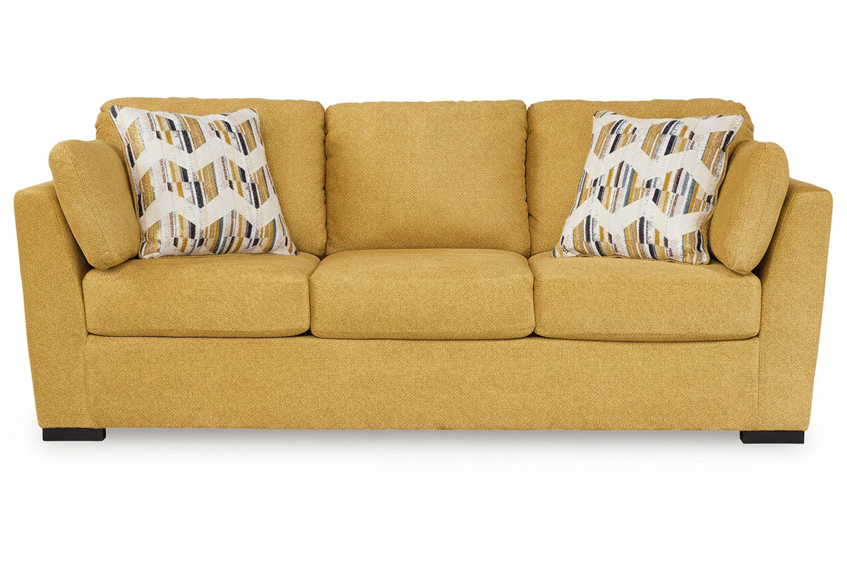 Yellow sofa with patterned cushions on a white background