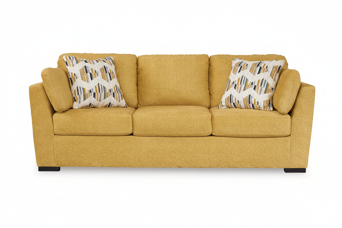 Yellow sofa with patterned cushions on a white background