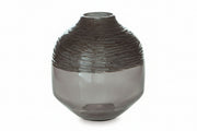 Smoky gray glass vase with ribbed texture on a white background