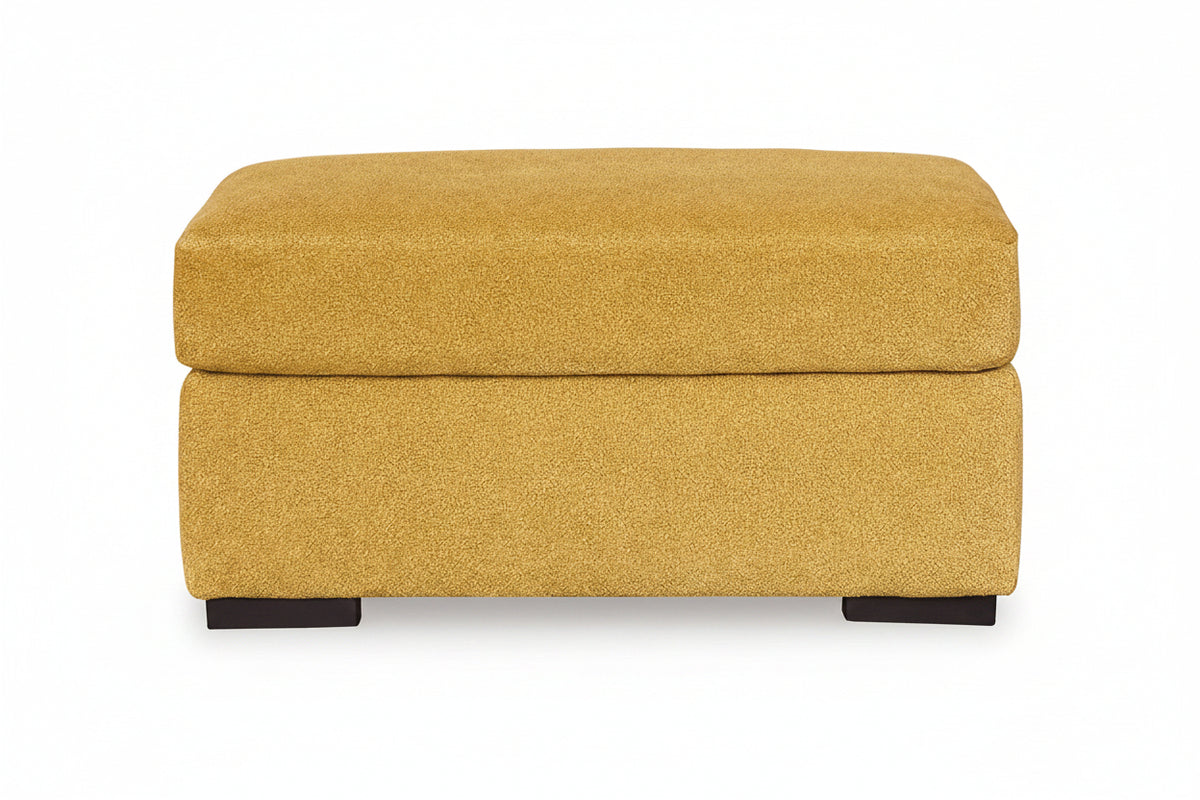 Yellow ottoman with a textured surface on a white background