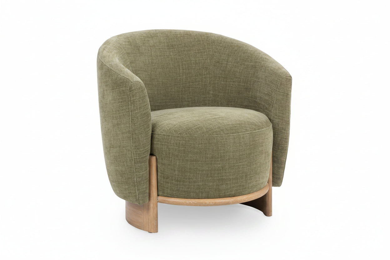 Green upholstered armchair with wooden legs on a white background