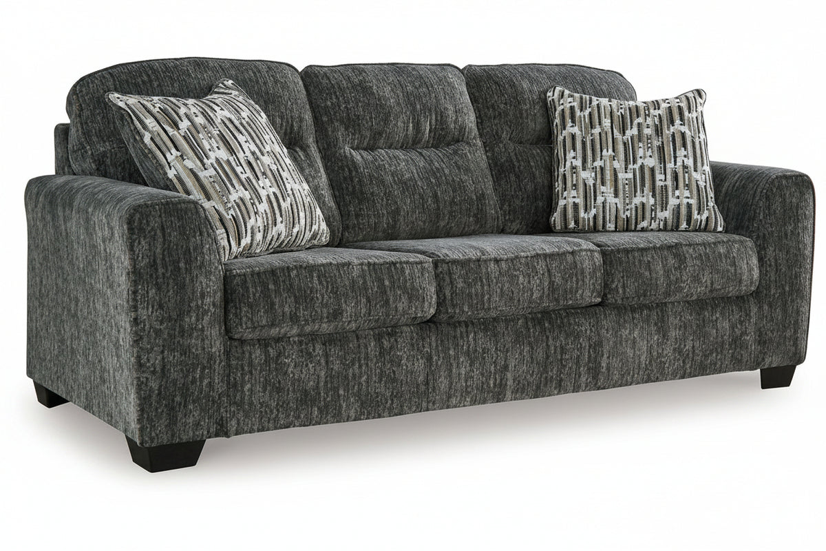 Gray sofa with patterned cushions on a white background