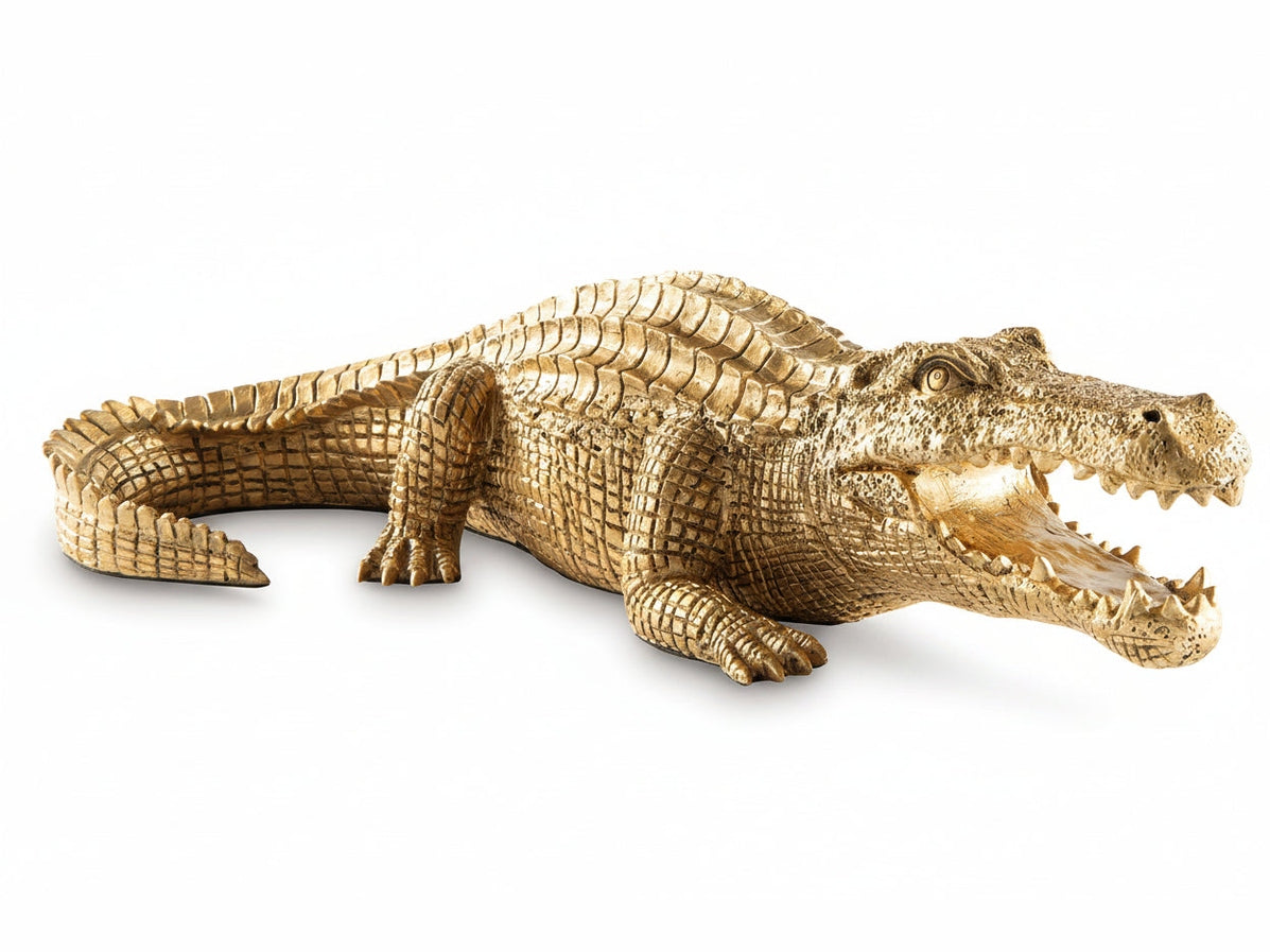 Lauretman gold alligator figurine on a white background.