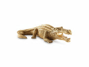 Lauretman gold alligator figurine on a white background.