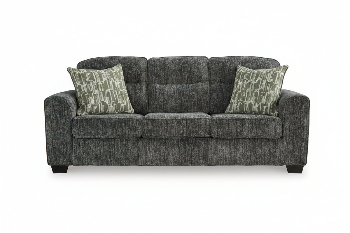 Gray sofa with patterned cushions on a white background