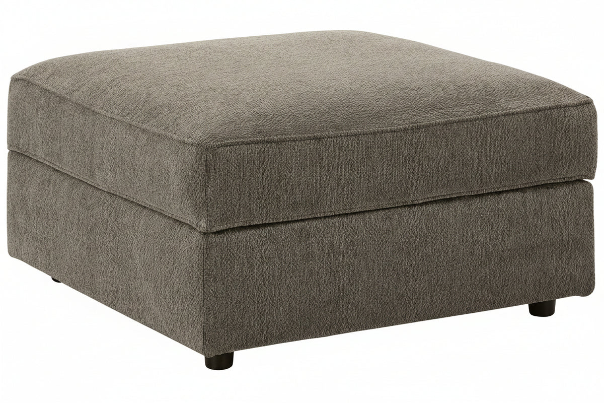 Gray upholstered ottoman on a white background