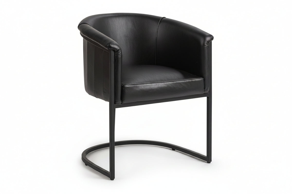 Black leather armchair with metal frame on a white background