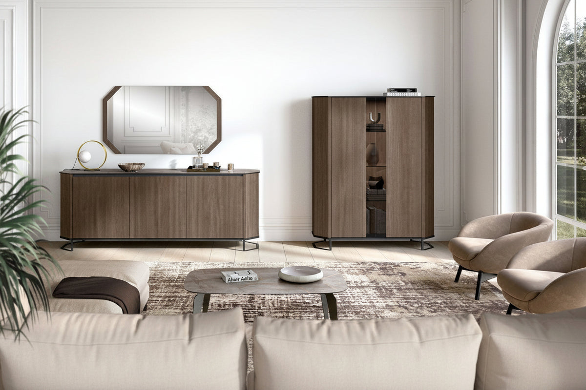 A modern living room furniture set featuring a brown wooden sideboard with an octagonal mirror, a matching tall cabinet, two beige armchairs, and a patterned rug on a light-colored floor.