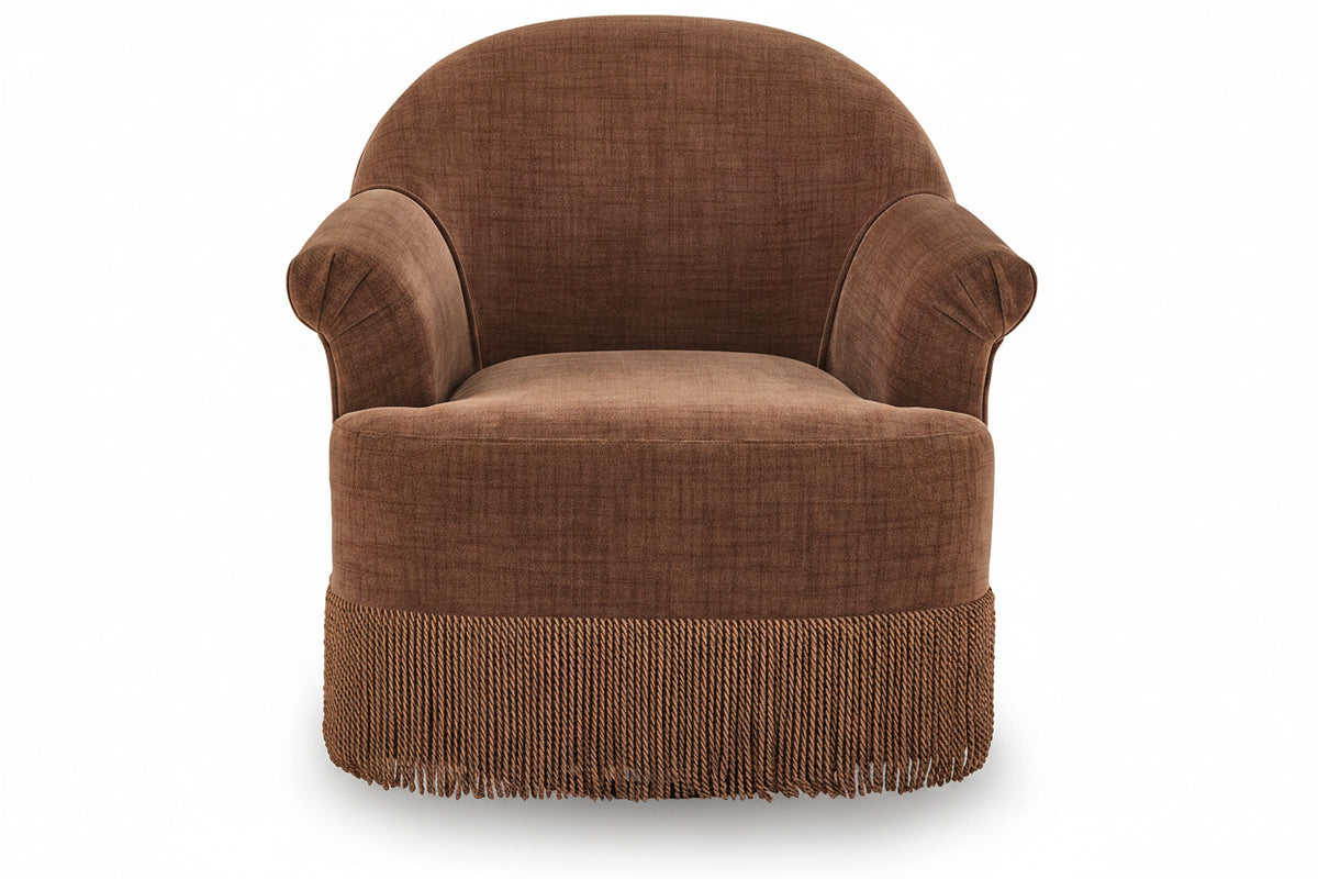 A brown upholstered armchair with rolled arms, a rounded backrest, and a fringed skirt base, shown against a plain white background.