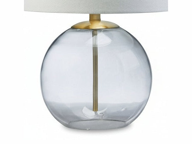 Samder table lamp with a clear glass base and white shade on a white background