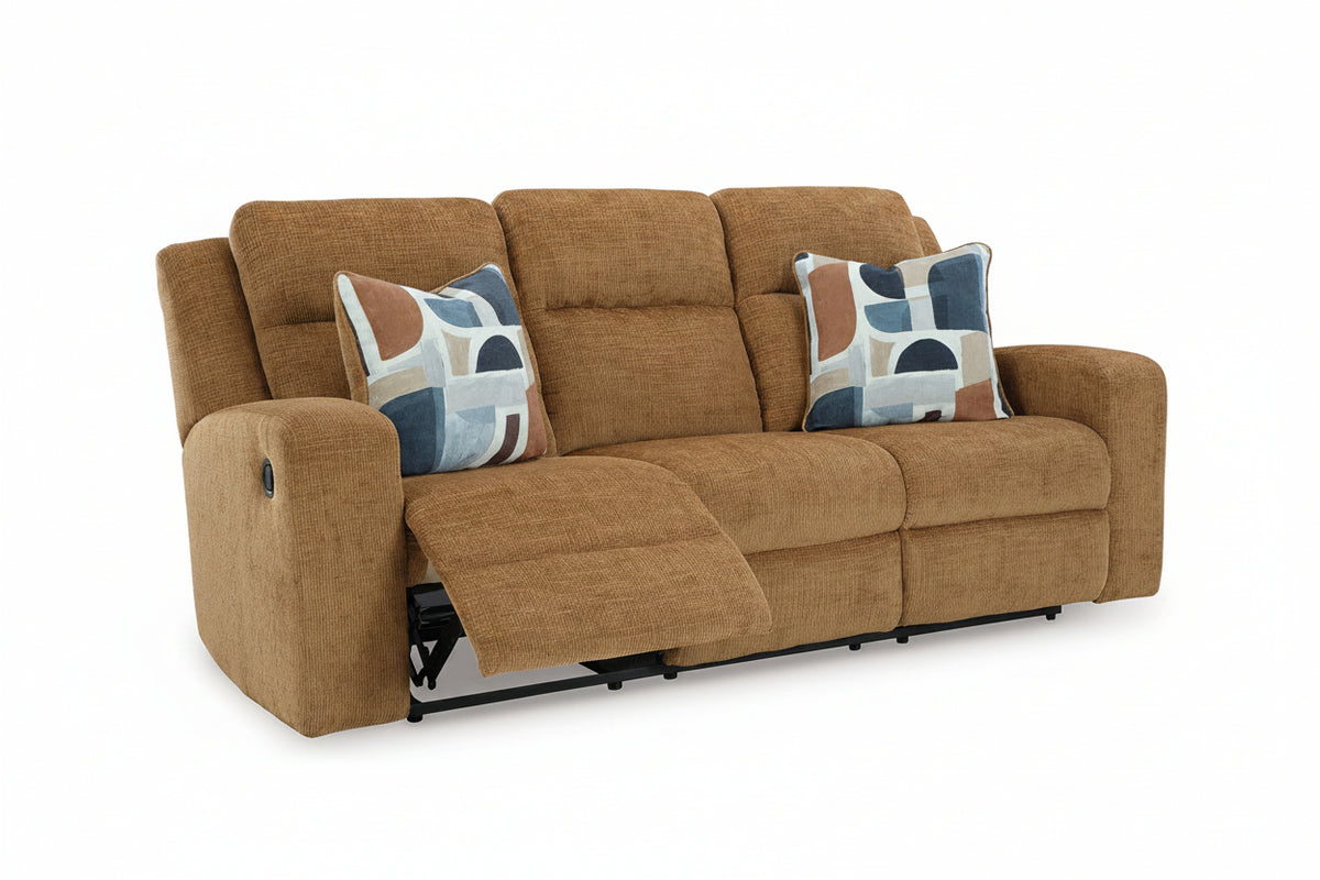 Brown sofa with reclining mechanism and patterned cushions on a white background