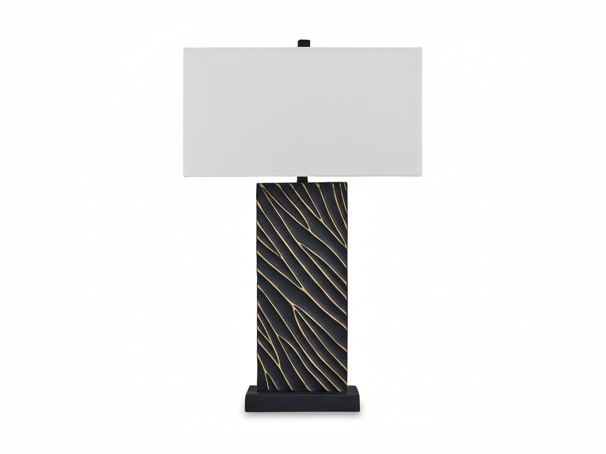 Bartlen table lamp with black base featuring gold patterns and white shade on a white background.