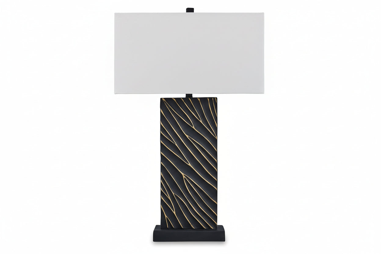 Bartlen table lamp with black base featuring gold patterns and white shade on a white background.