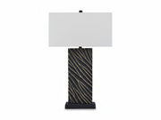 Bartlen table lamp with black base featuring gold patterns and white shade on a white background.
