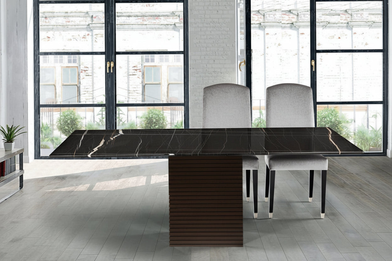Modern dining table with marble-like surface in a stylish room with large windows.