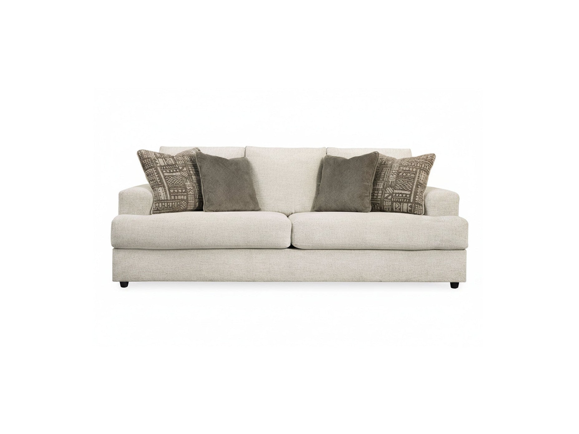 Beige sofa with patterned cushions on a white background