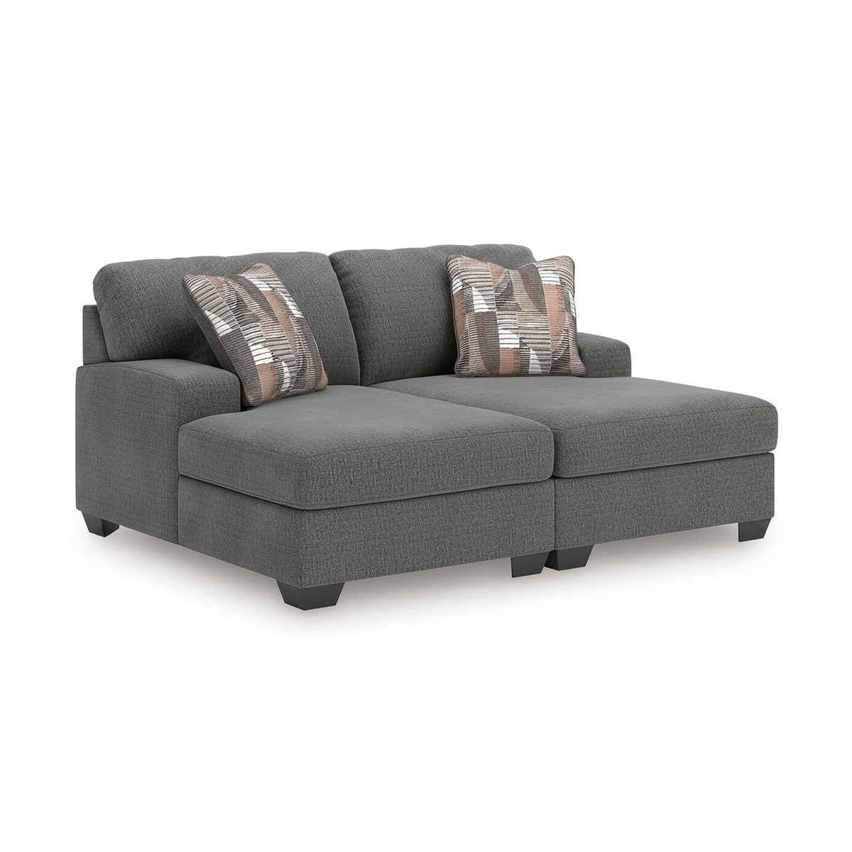 Gray sectional sofa with patterned cushions on a white background